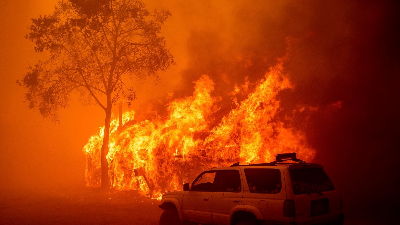 Lightning and a burning car pushed into a gully are blamed for wildfires in the West