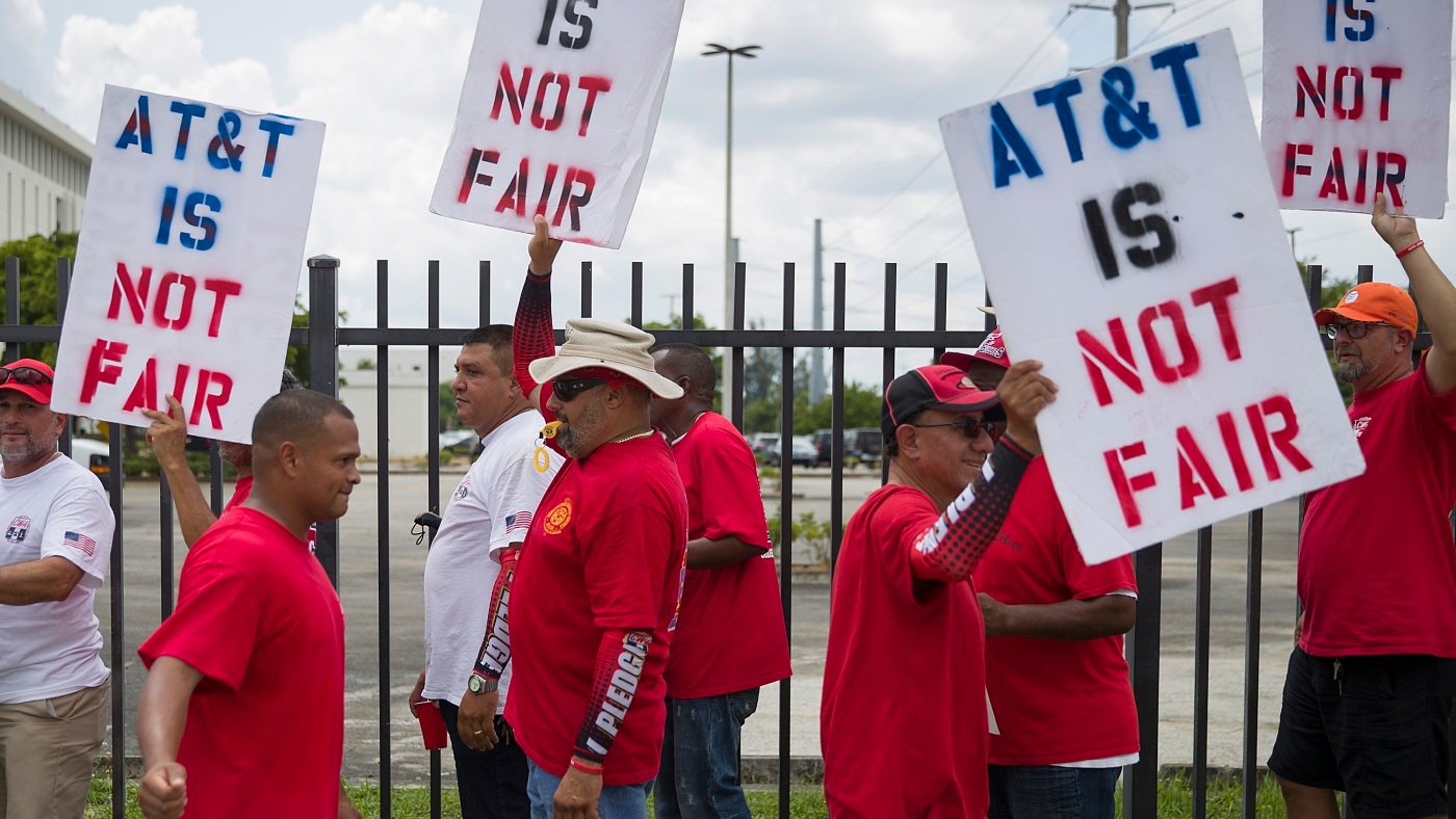 17,000 AT&T workers have been on strike for three weeks. Here's why.