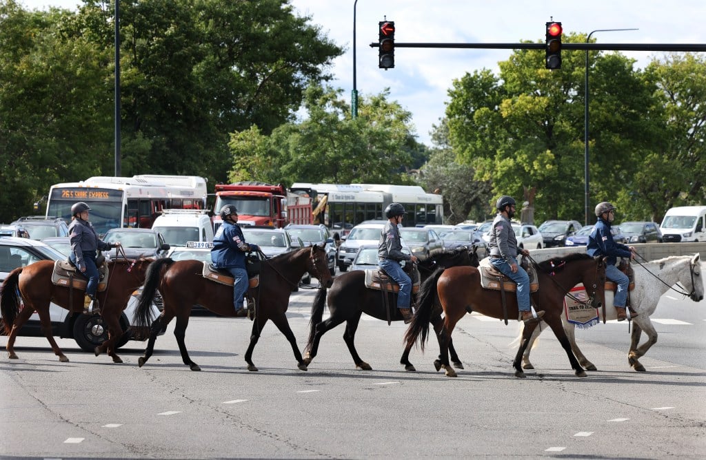 Horses walk along Lake Michigan for awareness of veteran suicide