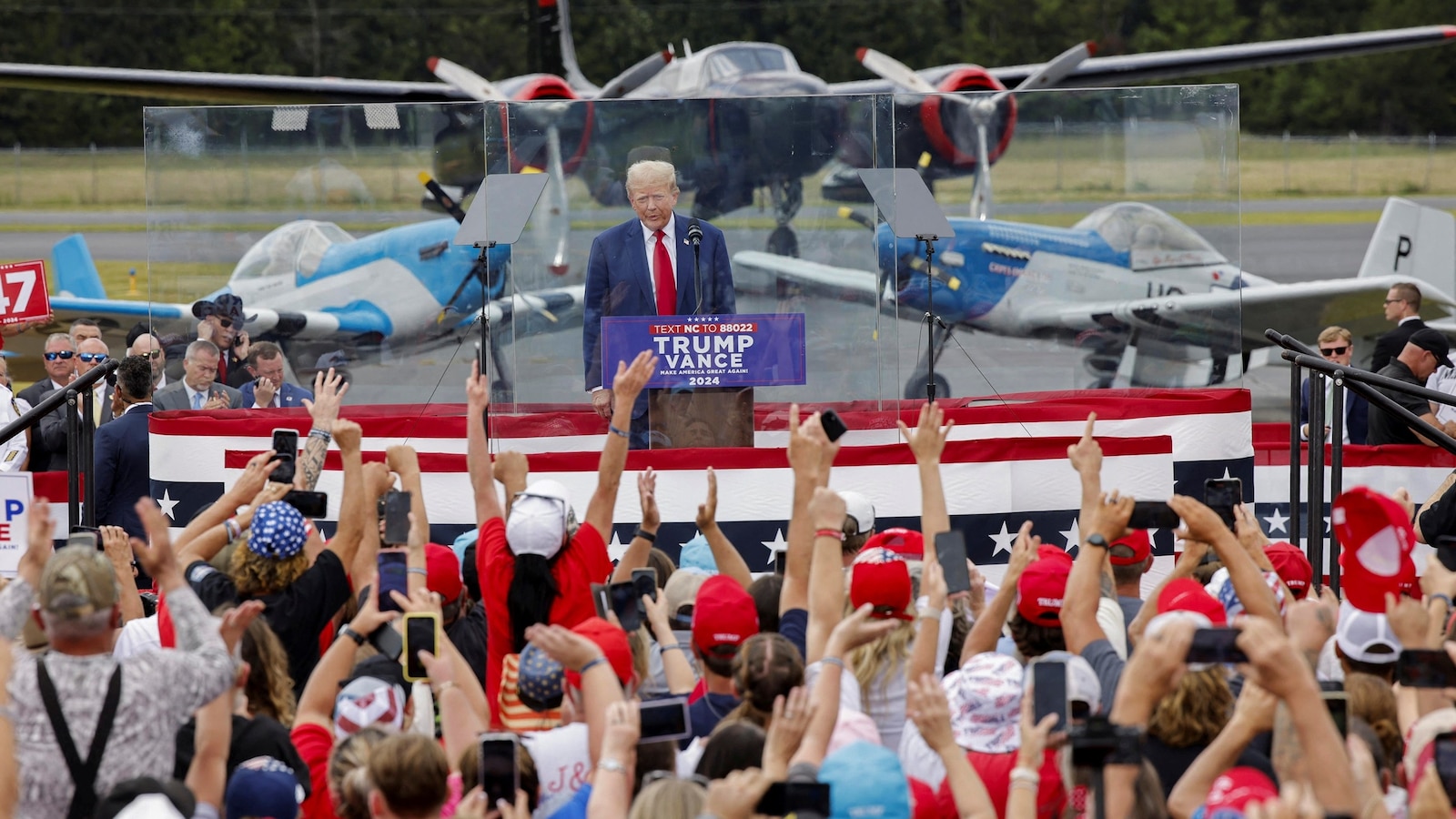 Trump speaks from behind bulletproof glass at 1st outdoor rally since Butler shooting