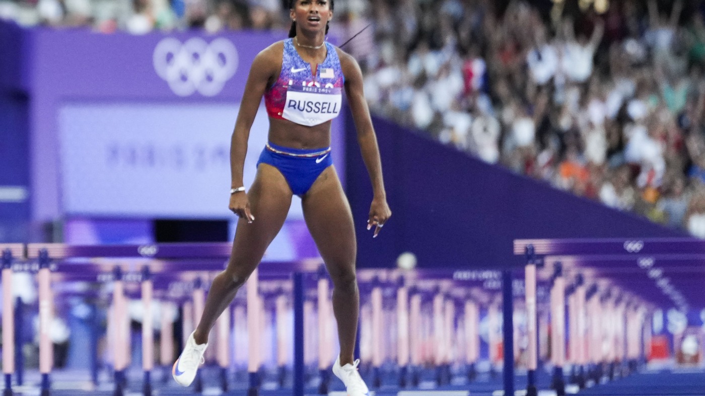 American Masai Russell wins Olympic gold in 100m hurdles by a 100th of a second