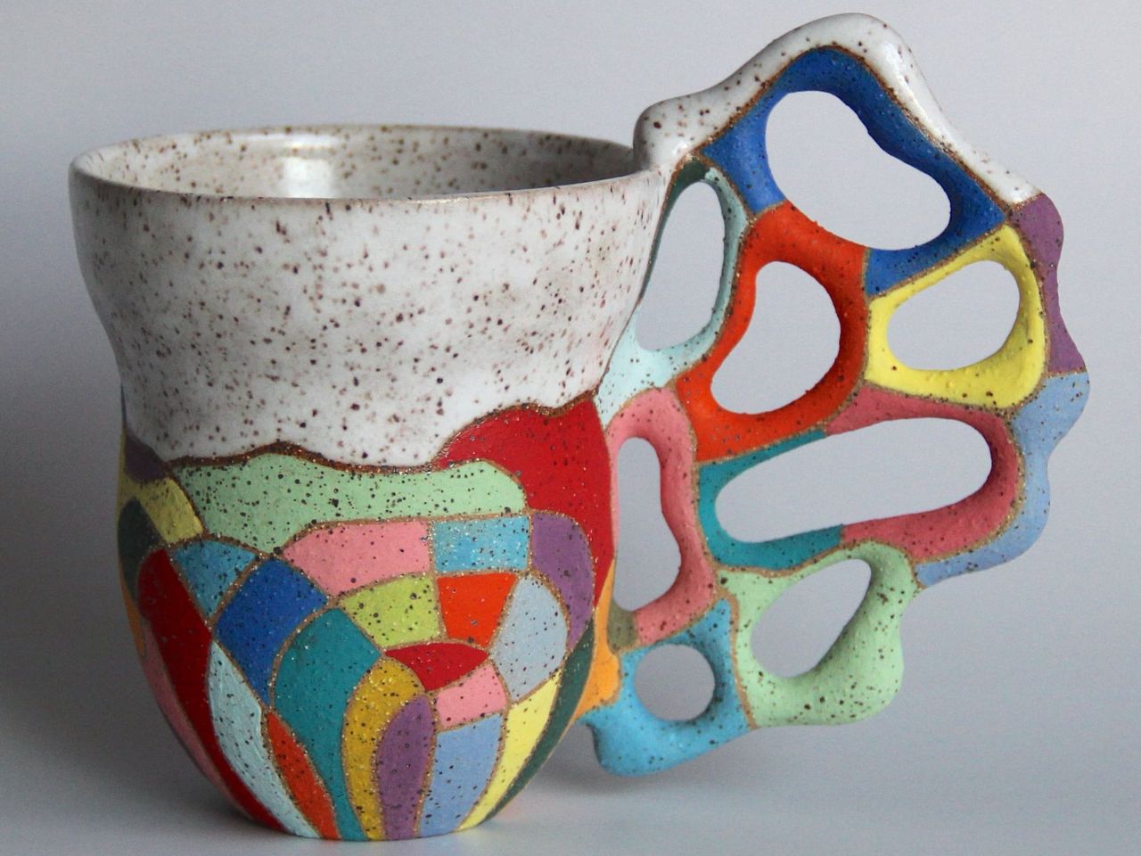 Biomorphic handles on these ceramic mugs add a touch of nature and quirk to lifestyle design