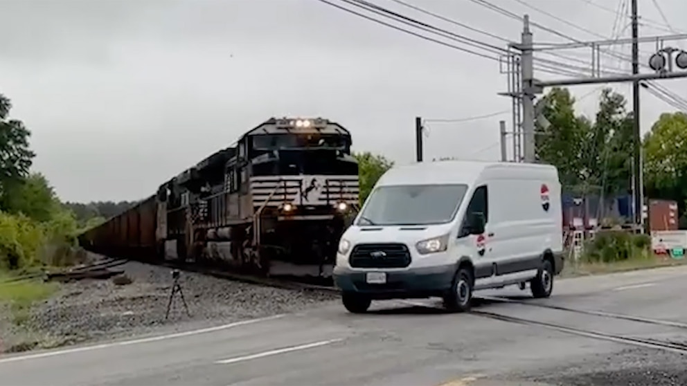 WATCH: Van narrowly misses being hit by oncoming train at crossing