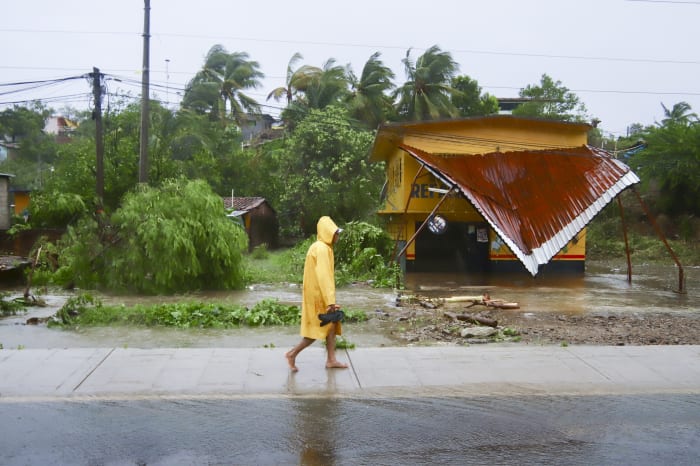 John as a tropical storm hits Mexico's Pacific coast a 2nd time