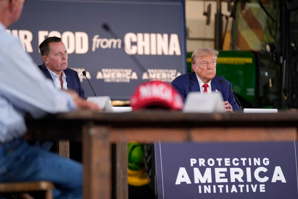 Trump listens during a farming event in rural Pennsylvania, then threatens John Deere with tariffs