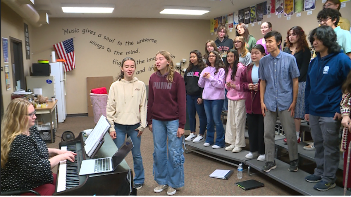 The Vanguard School student choir prepares to perform alongside Foreigner at Ford Amphitheater