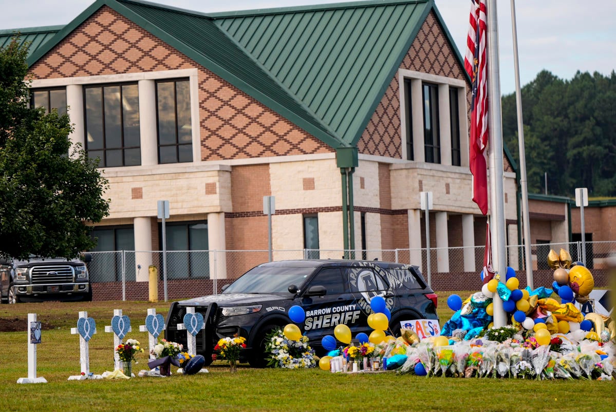 Mom of suspect in Georgia school shooting indicted and is accused of taping a parent to a chair