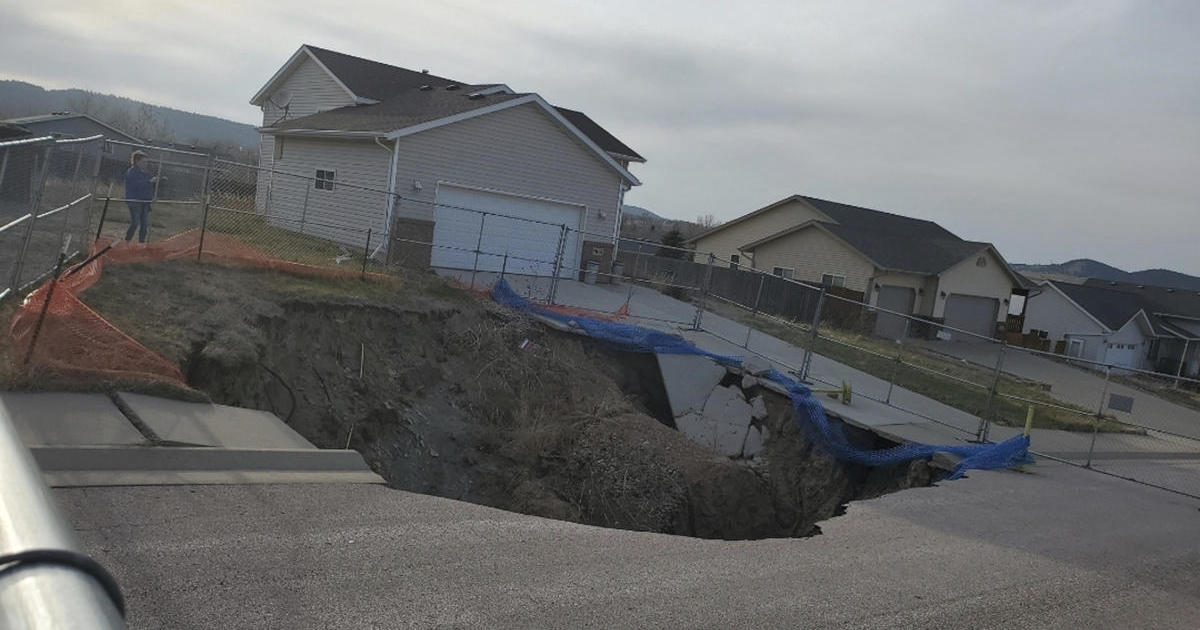 Giant sinkholes in a South Dakota neighborhood leave some families "panicked and stuck"