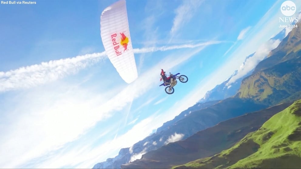 WATCH: Extreme athlete combines motocross with paragliding