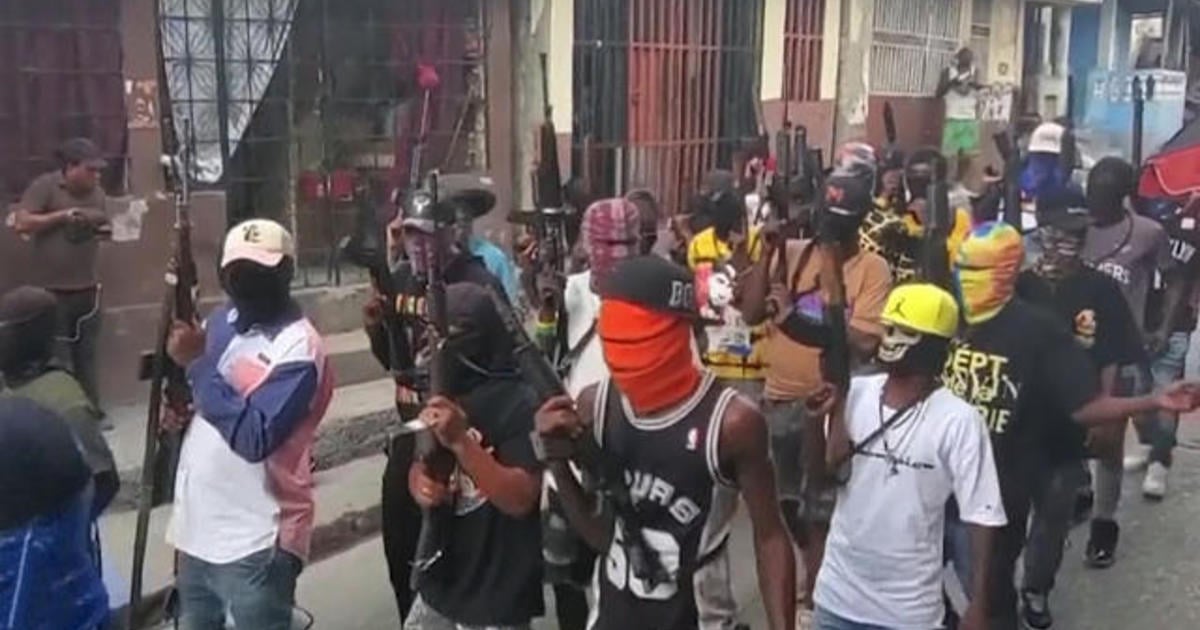 Gang in Haiti massacres 70; leader blames victims as thousands flee