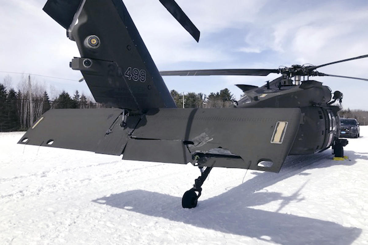 A snowmobiler who crashed into a parked Black Hawk helicopter is awarded $3 million