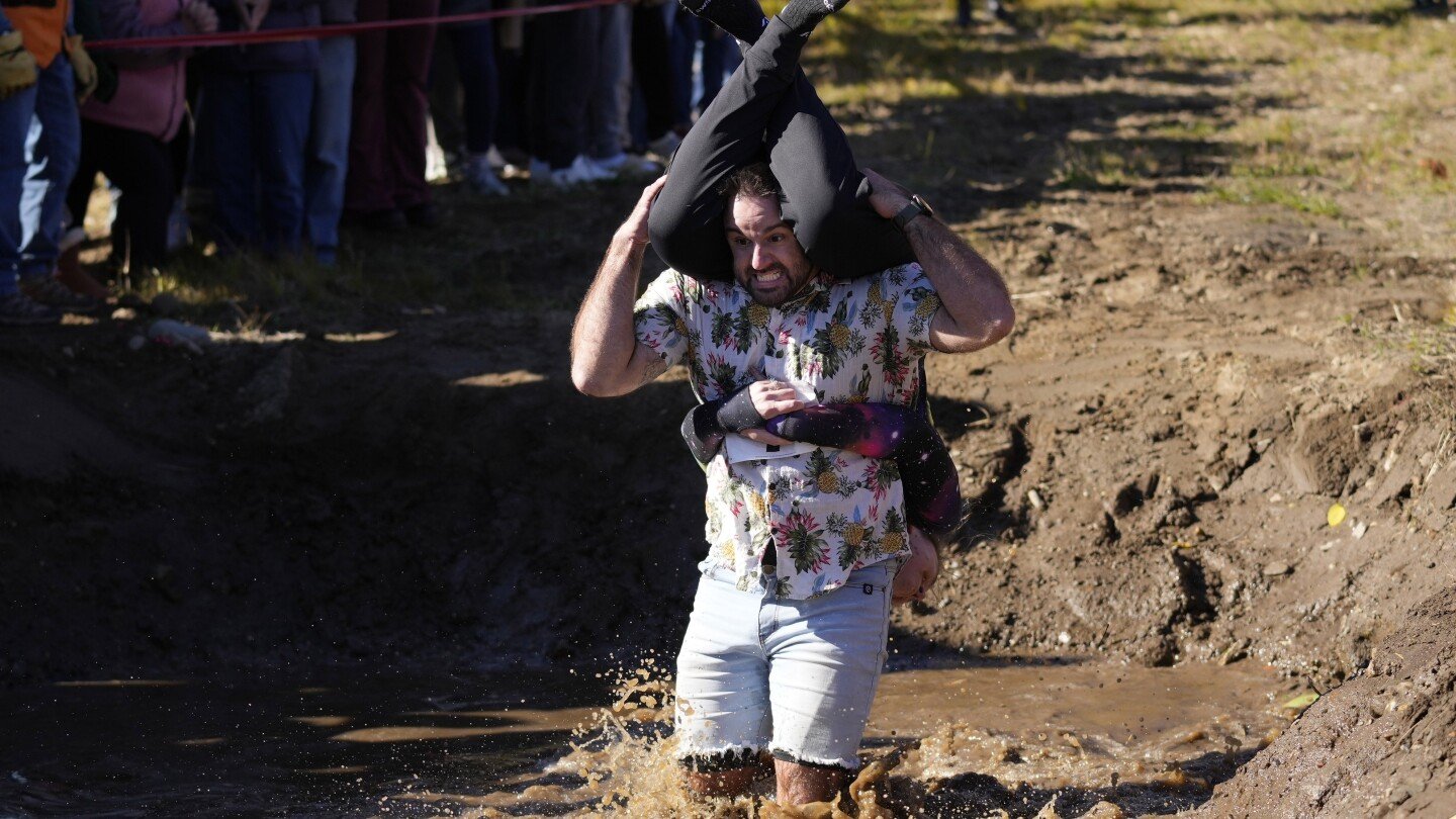 Wife-carrying championship victory brings beer, cash