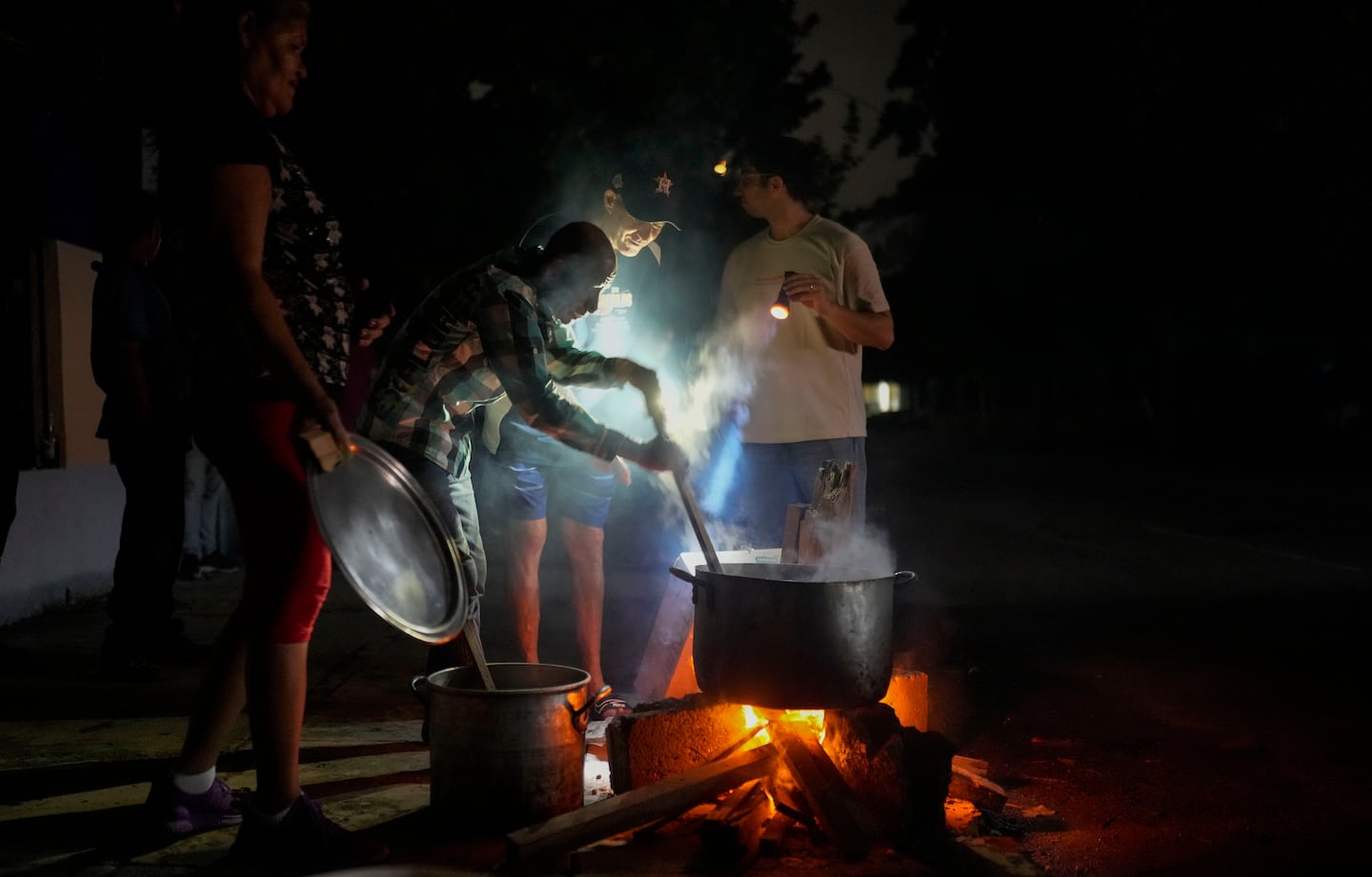 Cuba fights to come back from a nationwide blackout, then a storm that killed 7