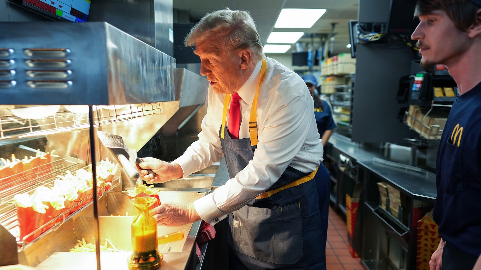 Trump mocks Harris' story from behind the fryer at McDonald's