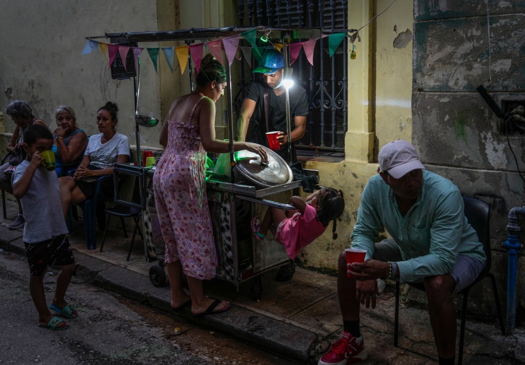 Cuba fights to come back from a national blackout, storm that killed 7