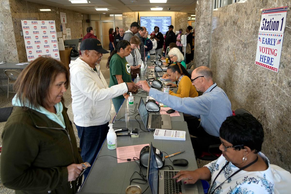 You might see election observers at the polls Tuesday. Here's what they can and can't do.