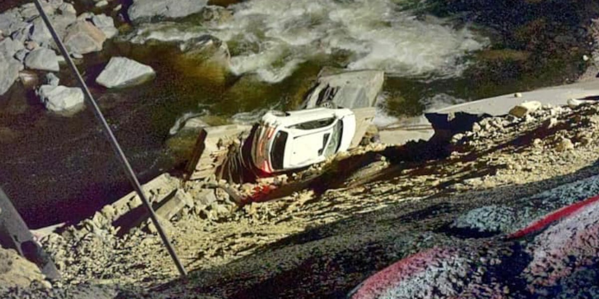 Photos: SUV plunges down I-40 embankment after driving around barriers