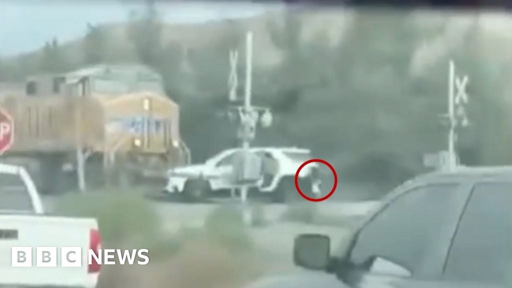 Children saved from car stuck in path of oncoming train