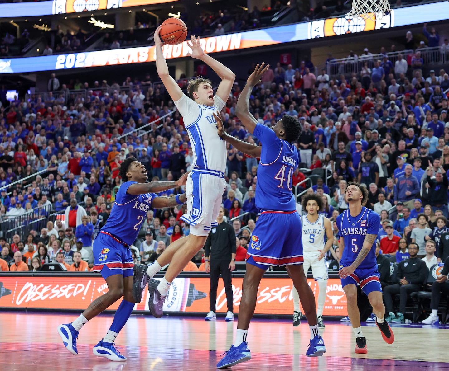 No. 1 Kansas holds off Cooper Flagg, No. 11 Duke in Vegas