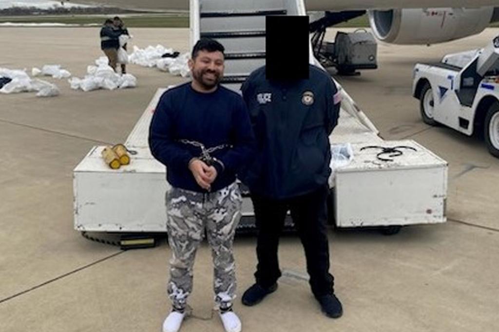 Illegal migrant and accused killer flashes sinister smile as ICE deports him back to his home country