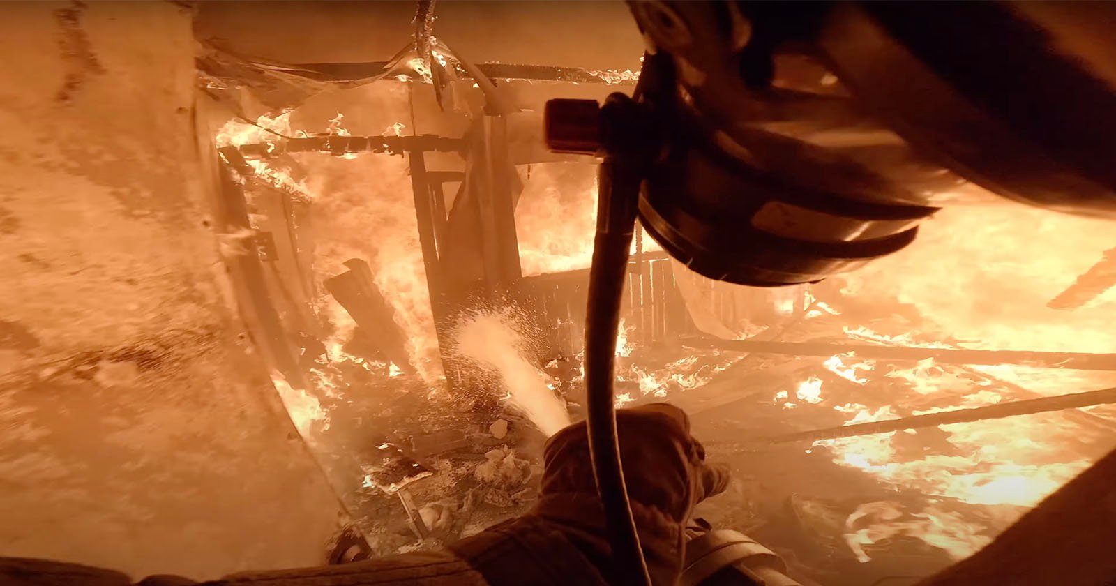 Intense POV Footage Shows Brave Firefighter Extinguish a Burning Building