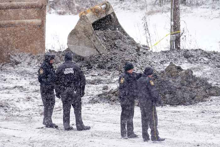 Digging resumes in the search for a woman in a Pennsylvania sinkhole