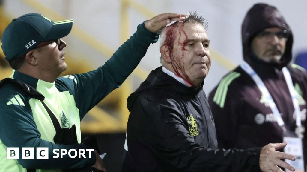 Honduras punished after Mexico coach hit by beer can