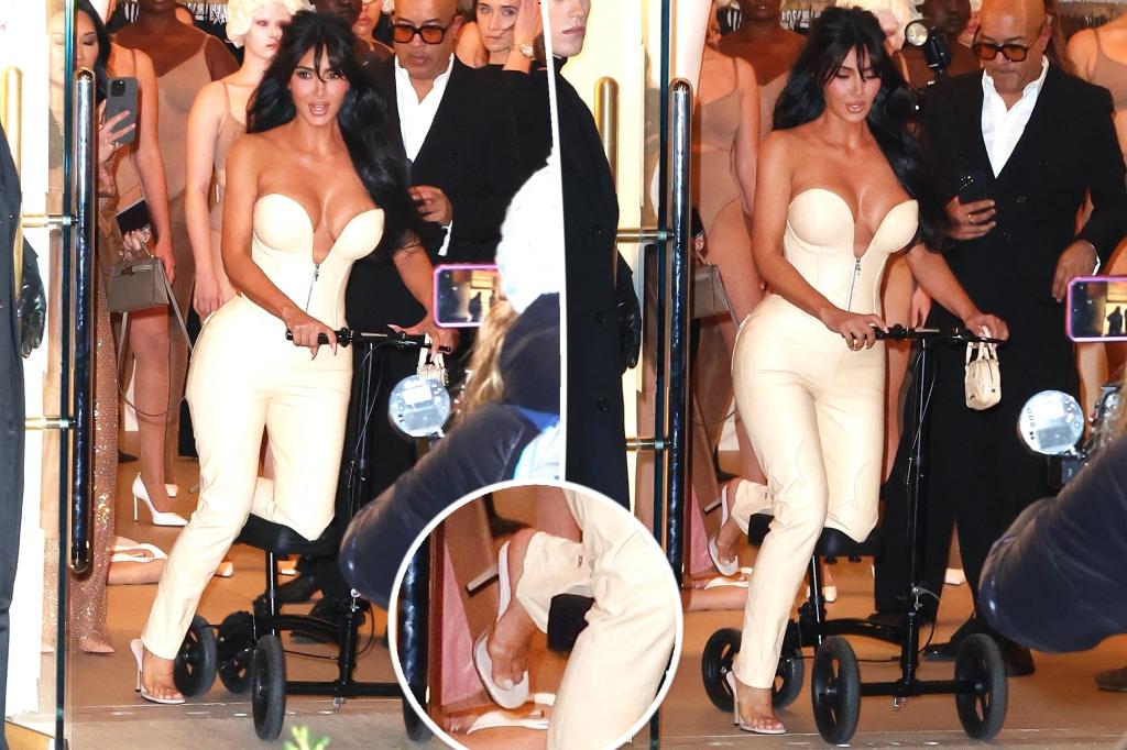 Kim Kardashian scoots on knee walker as she refuses to ditch heels with broken foot