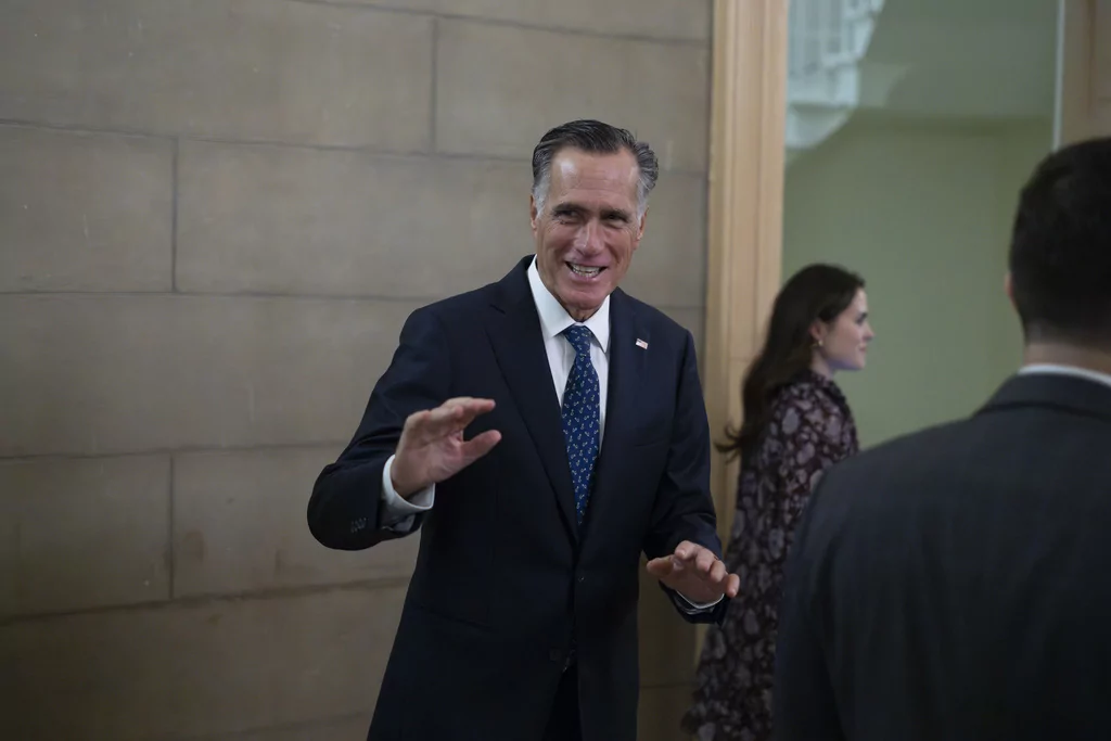 Romney defends Trump and asks critics to 'give him a chance'