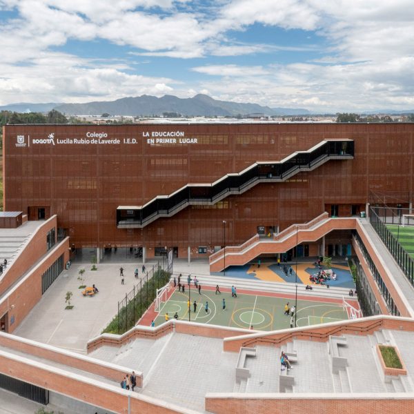 Nómena Arquitectura shades school in Bogotá with perforated metal panels