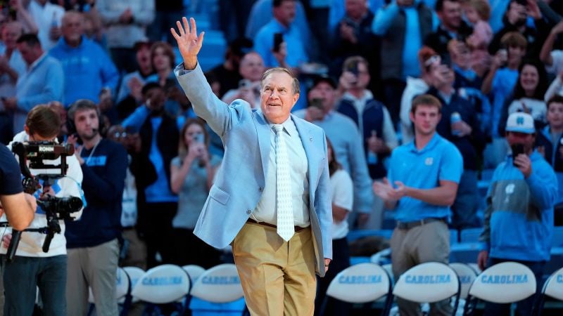 Bill Belichick gets enthusiastic reception at UNC basketball game having been unveiled as the new football coach