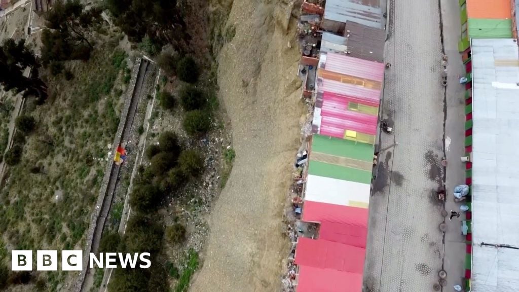 Bolivian shamans refuse to leave shacks on deadly cliff edge