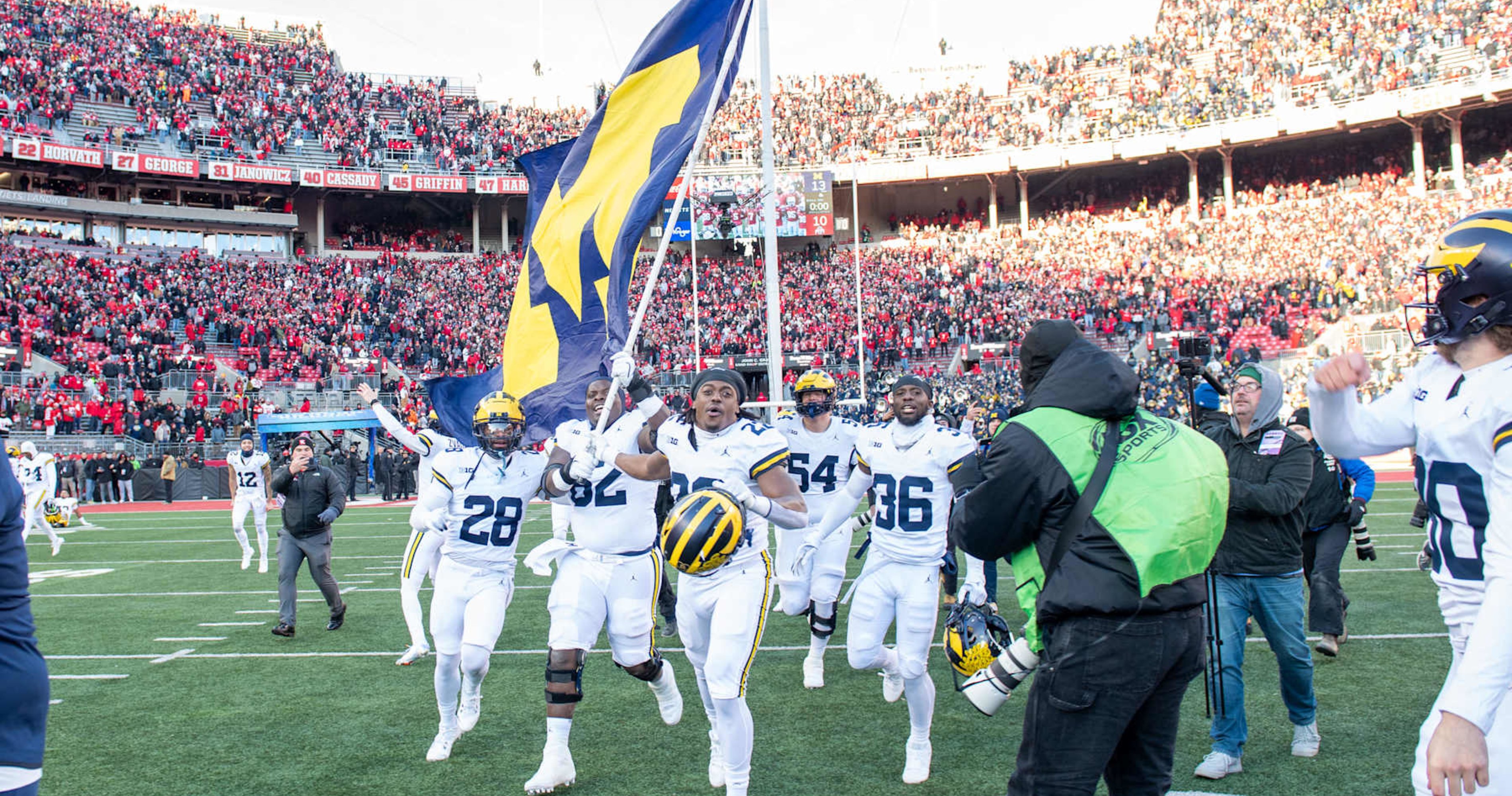 Video: Sherrone Moore Trolls Ohio State with Flag-Plant Gesture at Michigan CBB Game