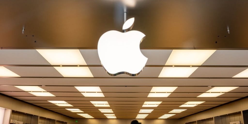 An Apple employee is suing, saying the company monitors personal devices and stops staff from talking about pay