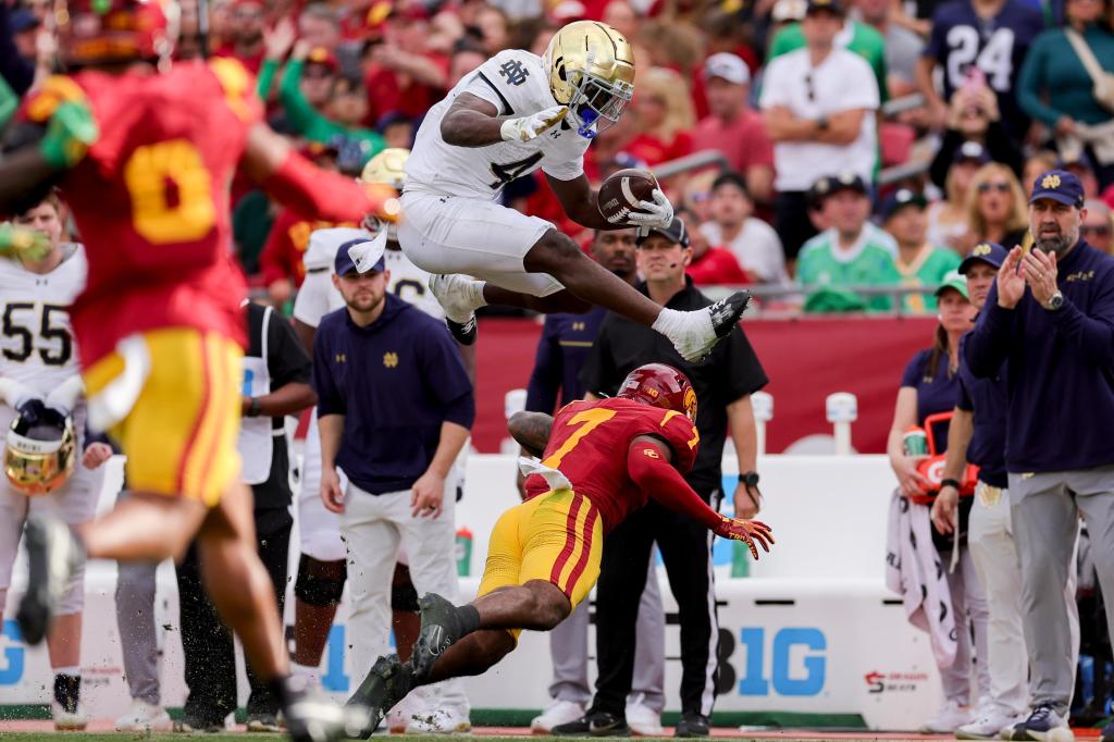 No. 5 Notre Dame beats USC with 2 late interception return TDs