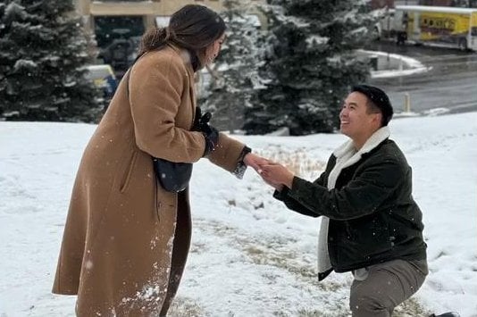 Ring vanishes into the snow during engagement photo shoot in Utah