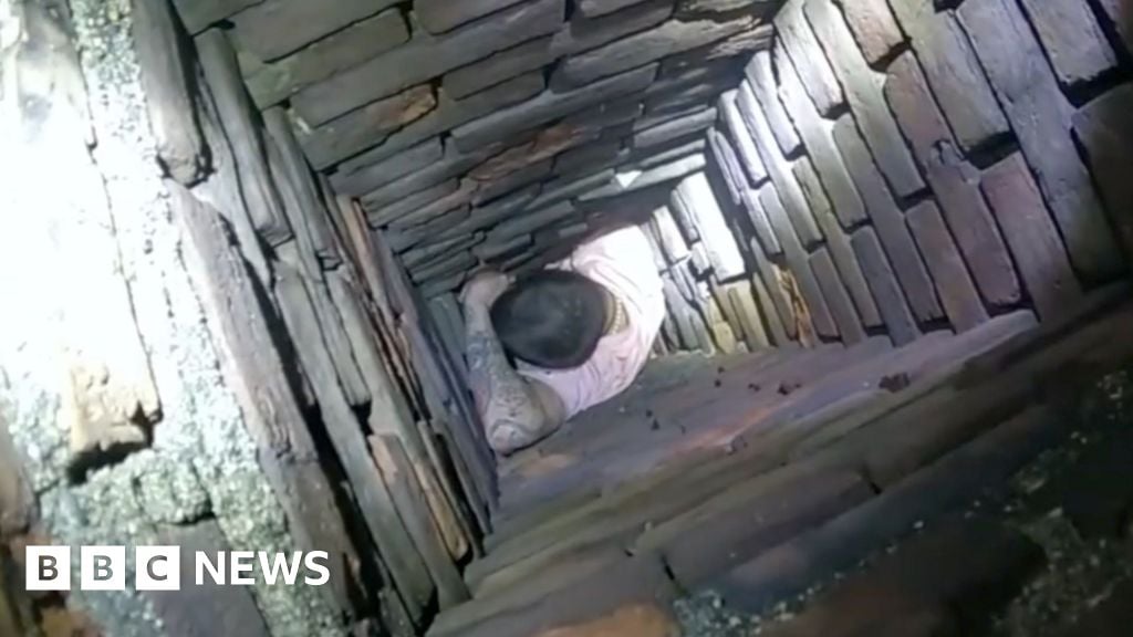 Watch: Man trying to escape police gets stuck in chimney