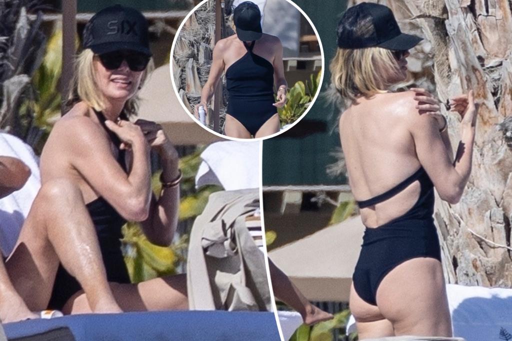 Charlize Theron soaks up the sun in a black swimsuit on Mexico vacation