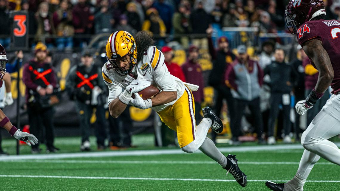 Dutch Fork product Elijah Spencer helps Minnesota defeat Virginai Tech to win the Duke's Mayo Bowl in Charlotte