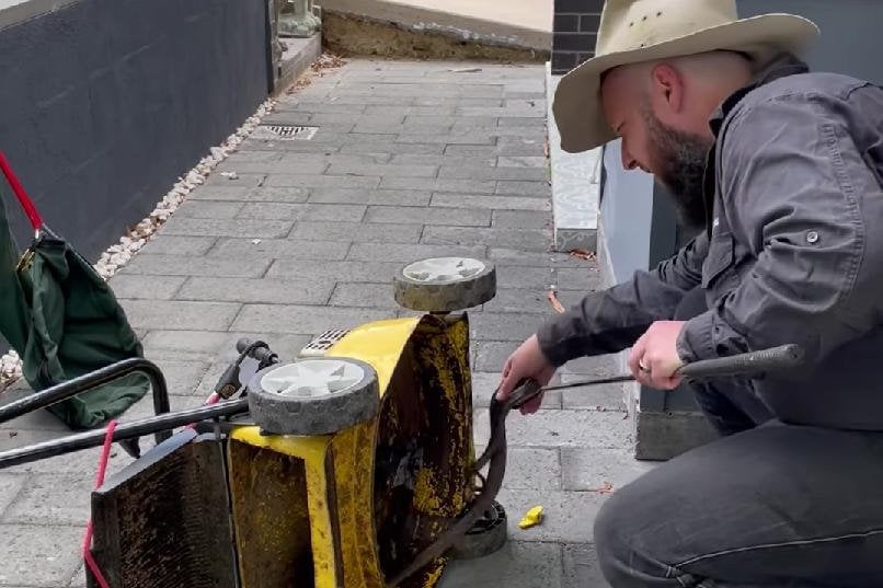 Deadly snake found hiding inside lawn mower